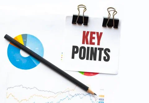 Notepad with text KEY POINTS on business charts and pen Stock Photos