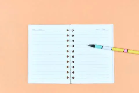 Notepad for text on a pastel color table with a copy. The concept of educatio Stock Photos