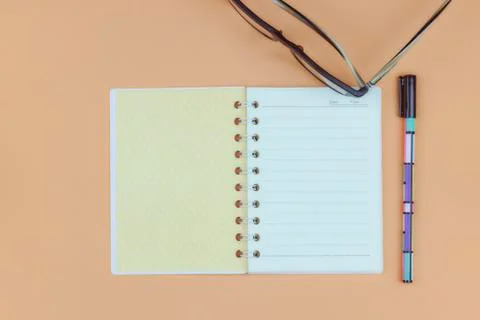 Notepad for text on a pastel color table with a copy. The concept of educatio Stock Photos