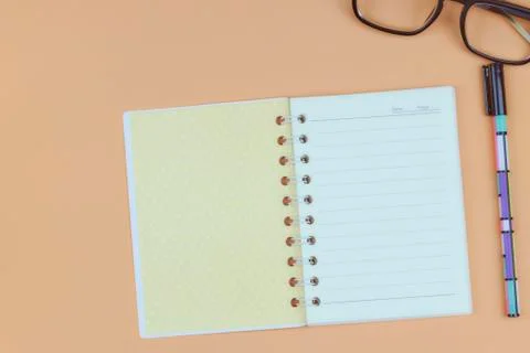 Notepad for text on a pastel color table with a copy. The concept of educatio Stock Photos