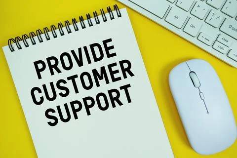 Notepad with the text "Provide Customer Support" and white keyboard and wir.. Stock Photos