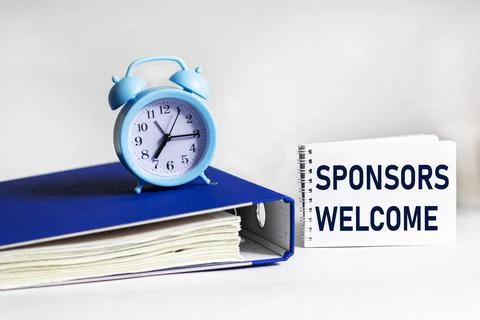 Notepad with text Sponsors Welcome. Folder with documents and a clock on a wh Stock Photos