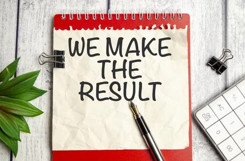 Notepad with text WE MAKE THE RESULT on a wooden background Stock Photos