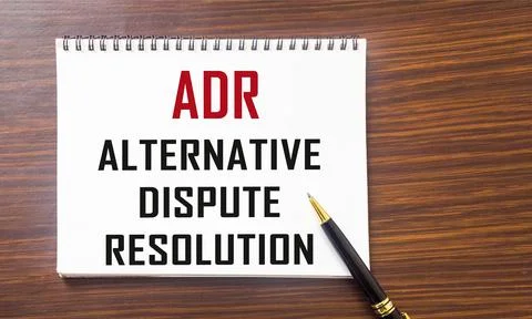 Notepad with title Alternative Dispute Resolution ADR on the table. 스톡 사진