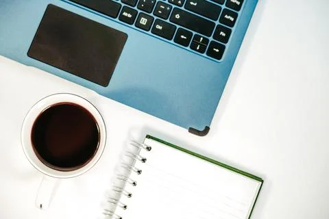 Notepad, white pen, cup of coffee and keyboard 스톡 사진