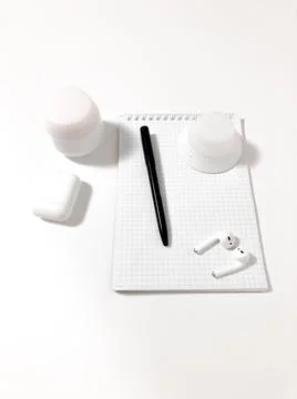 Notepad on a white table. Stock Photos