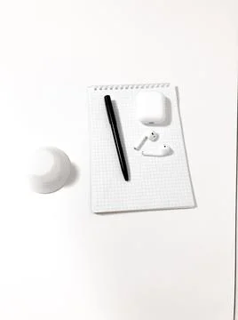 Notepad on a white table. Stock Photos