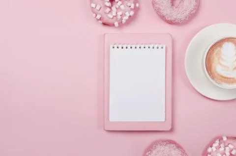 Notepad wish list for future plans. flat lay composition with donuts, notepad Stock Photos