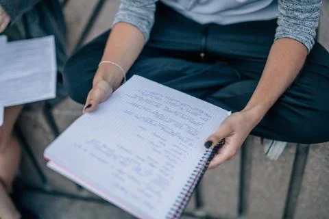 Notepad in woman's hands. Stock Photos