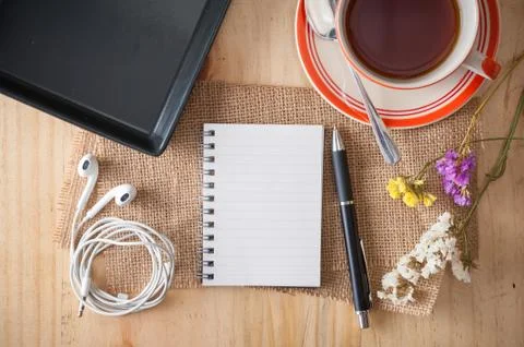 Notepad on wood table Stock Photos
