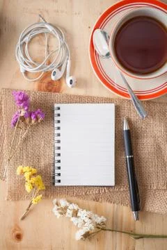 Notepad on wood table Stock Photos