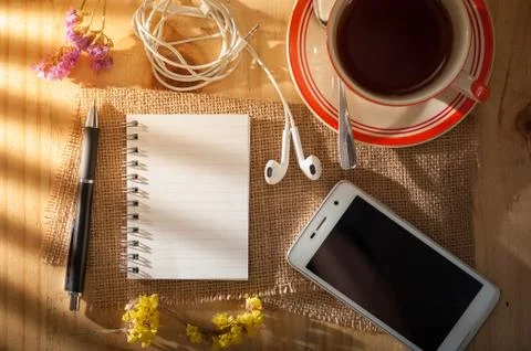 Notepad on wood table Stock Photos