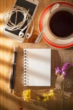Notepad on wood table Stock Photos