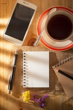 Notepad on wood table Stock Photos