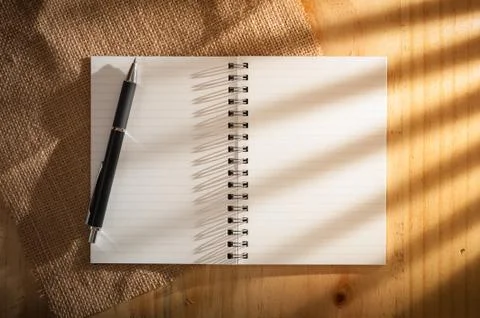 Notepad on wood table Stock Photos