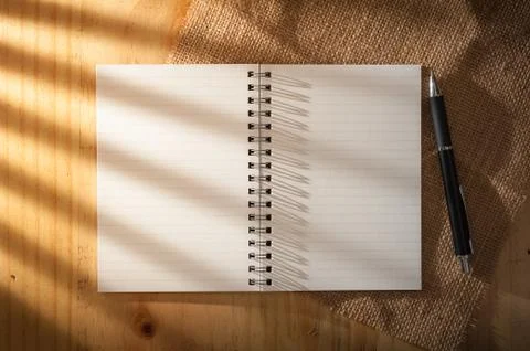 Notepad on wood table Stock Photos