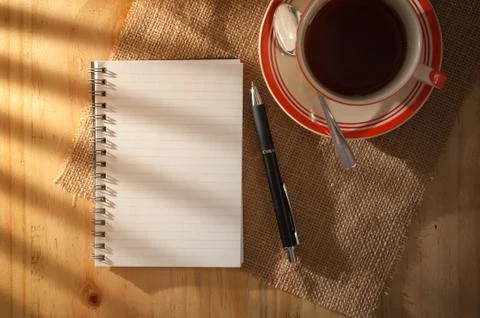 Notepad on wood table Stock Photos