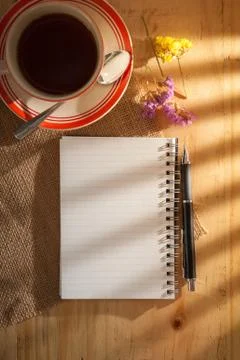 Notepad on wood table Stock Photos