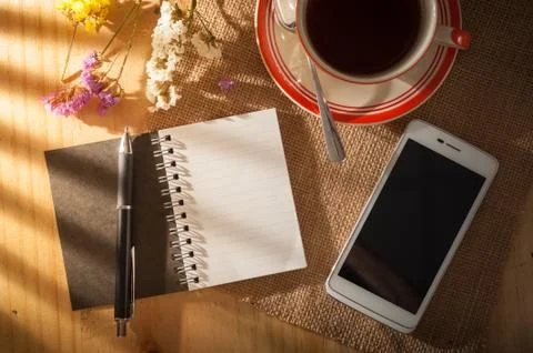 Notepad on wood table Stock Photos