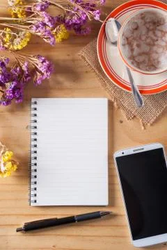 Notepad on wood table Stock Photos