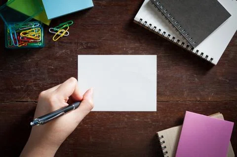 Notepad on wood table Stock Photos