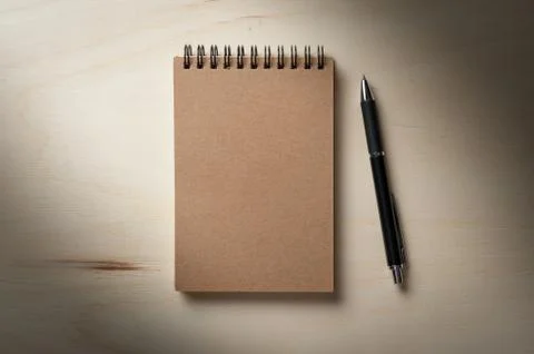 Notepad on wood table Stock Photos