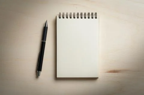 Notepad on wood table Stock Photos
