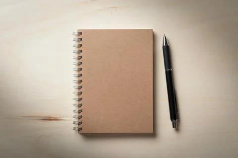 Notepad on wood table Stock Photos