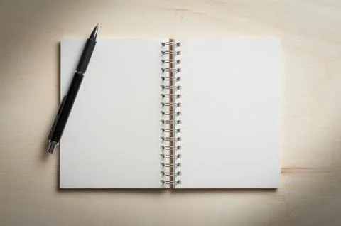 Notepad on wood table Stock Photos