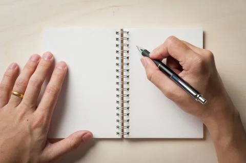 Notepad on wood table Stock Photos