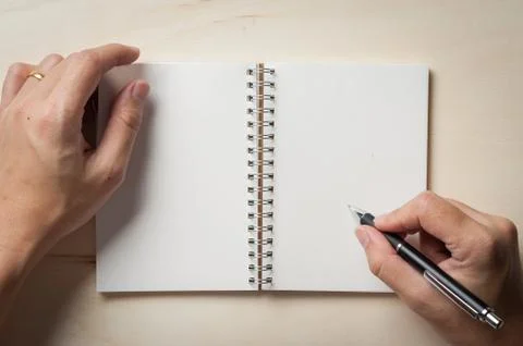 Notepad on wood table Stock Photos