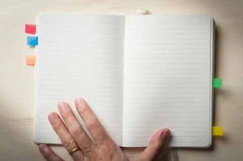 Notepad on wood table Stock Photos