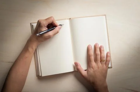 Notepad on wood table Stock Photos