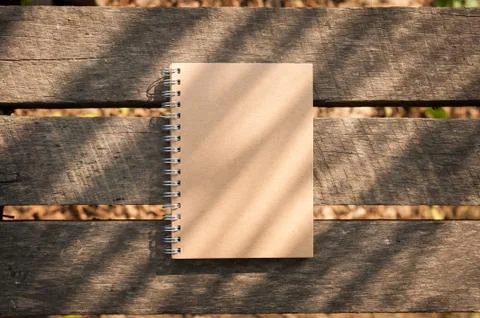 Notepad on wood table Stock Photos