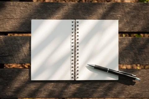 Notepad on wood table Stock Photos