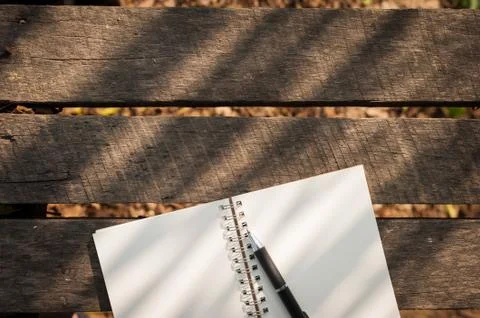 Notepad on wood table Stock Photos