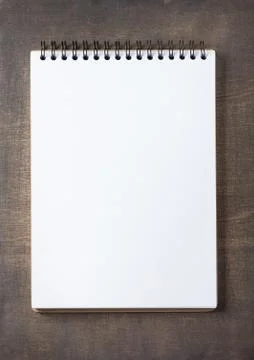 Notepad at wooden background surface table Stock Photos