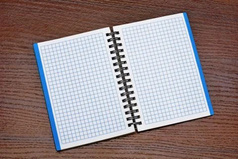 Notepad on a wooden table Stock Photos