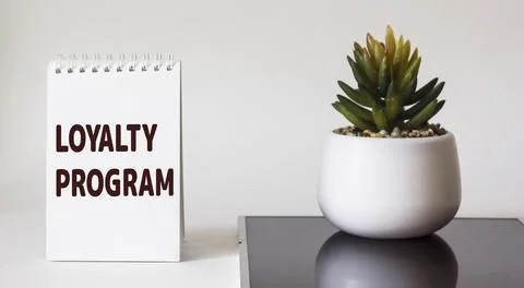 Notepad with word Loyalty program on white background 스톡 사진
