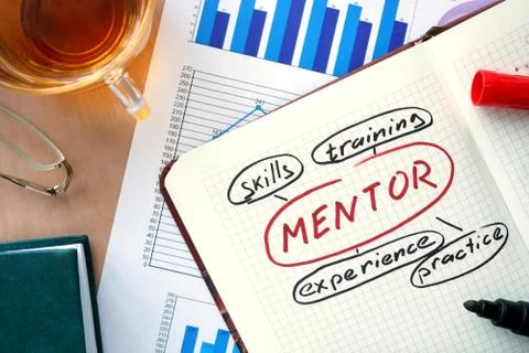 Notepad with word mentor and marker. Stock Photos
