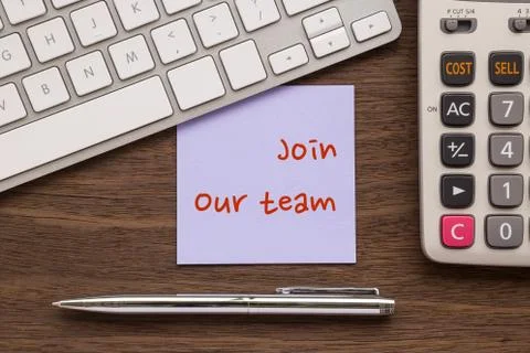 Notepad with words " Join Our Team " putting on workspace Stock Photos