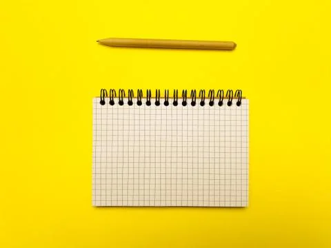 Notepad for writing on a yellow background Stock Photos