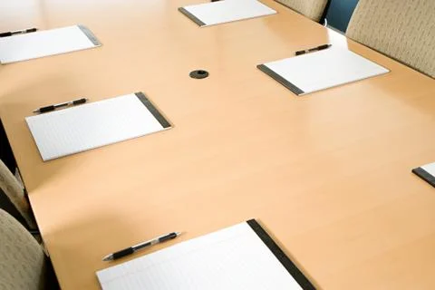 Notepads on conference table Stock-Fotos
