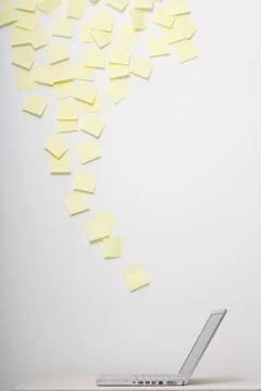 Notes and open laptop Stock Photos