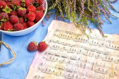 Notes and raspberries on the table, breakfast, good mood, opening, background Stock Photos
