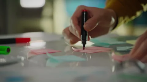 Notes. Corporate analyst in employee clothes, concentrated employee analyzin Stock Footage 260226270