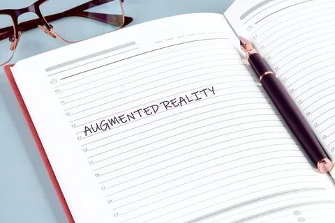 Notes focus on augmented reality concepts and ideas are written in a notebo.. Stockfoto's