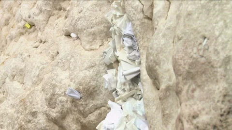 Notes with Prayers in the Western Wall in Jerusalem Stock Footage 722336