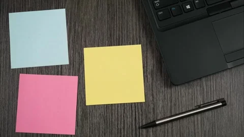 Notes with space for text appear on the employee's desk. Stop motion Stock Footage 255527050
