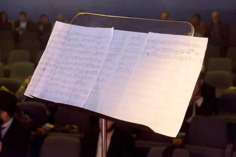 Notes for a violin stand on a stand on stage during a concert Stock Photos
